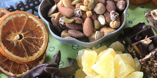 different dried fruits and nuts on plates
