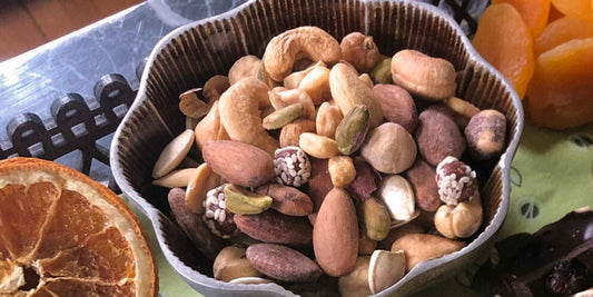 a bowl of iron rich nuts by Fastachi