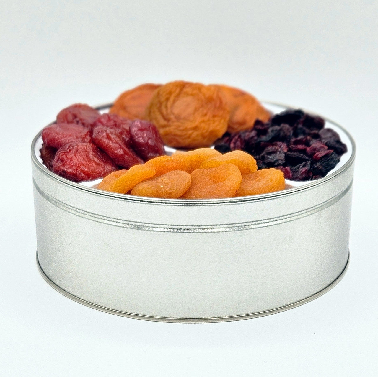 large gift tin with different dried fruits 